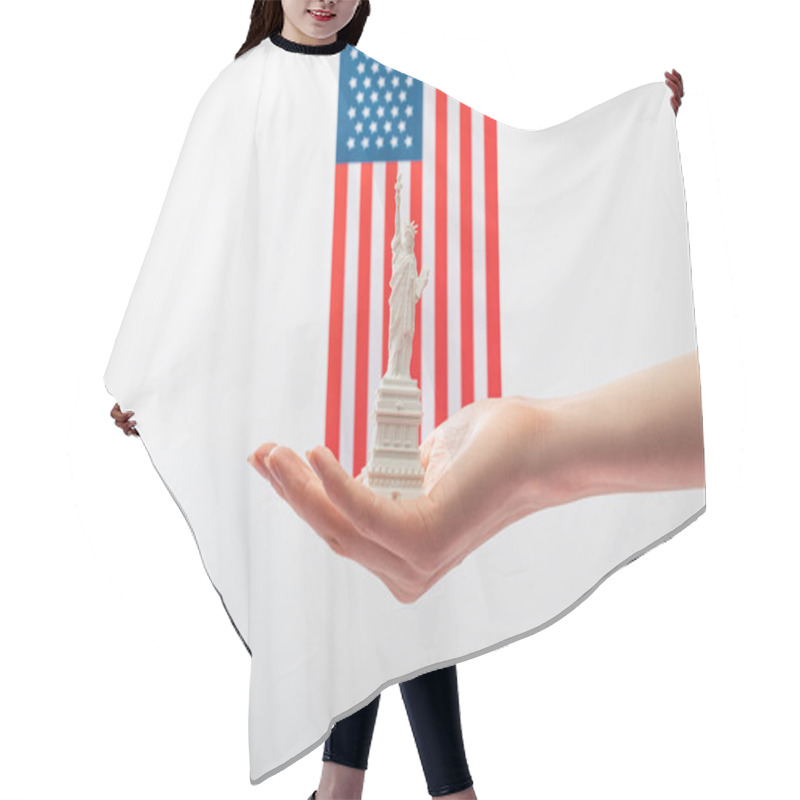 Personality  Cropped View Of Woman Holding Small Statue Of Liberty Near American Flag Isolated On White  Hair Cutting Cape