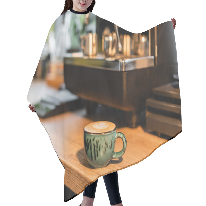 Personality  Cup Of Cappuccino Near Blurred Coffee Machine On Workshop In Coffee Shop Hair Cutting Cape