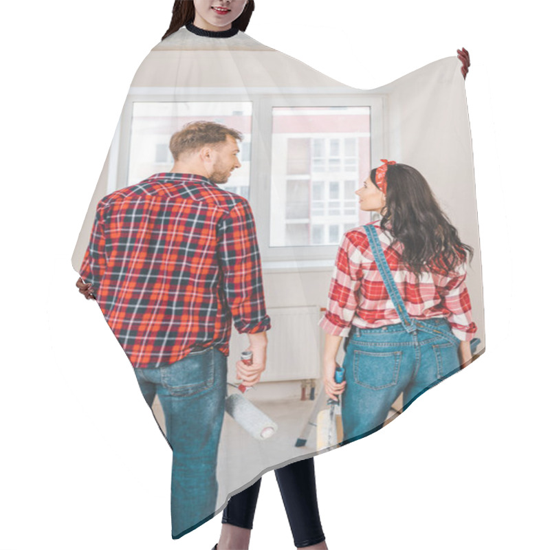 Personality  Man And Woman Holding Paint Buckets And Rollers While Standing Near Boxes Hair Cutting Cape