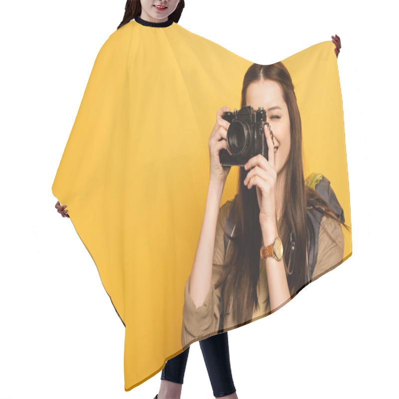 Personality  Attractive Female Tourist With Backpack Holding Photo Camera On Yellow  Hair Cutting Cape