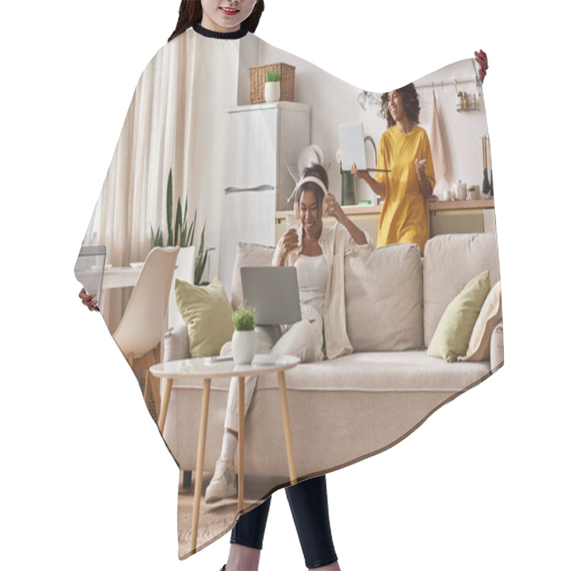 Personality  Two Young Women Share A Joyful Moment While Working From Home In Their Stylish Living Space. Hair Cutting Cape