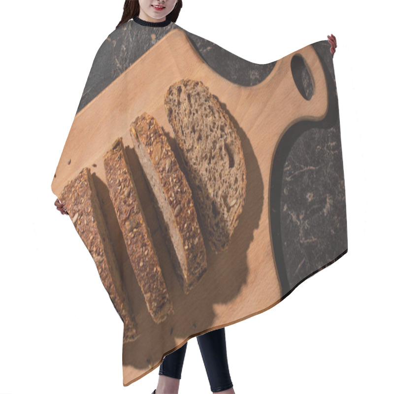 Personality  Top View Of Cut Whole Grain Bread On Cutting Board On Stone Black Surface Hair Cutting Cape