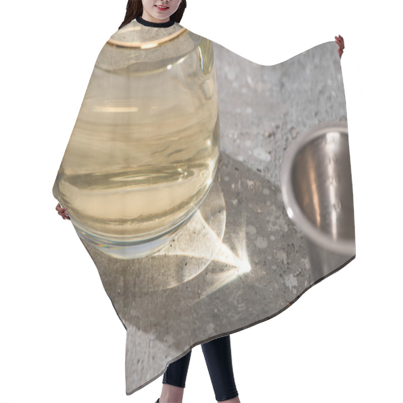 Personality  Selective Focus Of Transparent Glass With Golden Liquid On Concrete Surface With Jigger Hair Cutting Cape