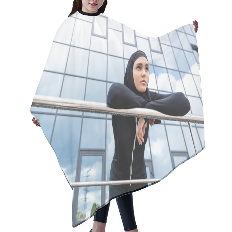 Personality  Low Angle View Of Muslim Woman In Hijab Standing Near Modern Building  Hair Cutting Cape