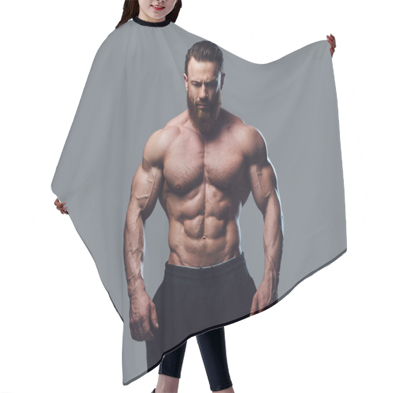 Personality  Portrait Of Bearded Shirtless Bodybuilder Over Grey Background. Hair Cutting Cape