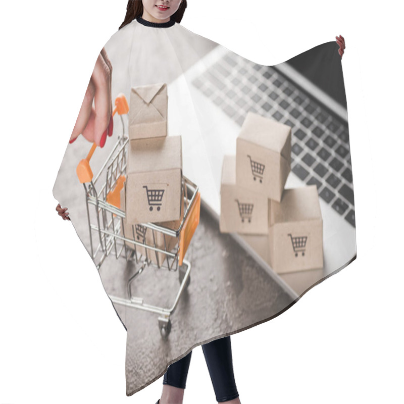 Personality  Cropped View Of Woman Holding Toy Shopping Cart With Small Boxes Near Laptop, E-commerce Concept Hair Cutting Cape