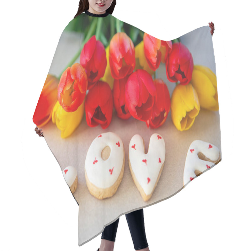 Personality  Love-themed Cookies With Tulip Bouquet. Close-up Of Heart-decorated Cookies Spelling LOVE Placed Next To A Vibrant Bouquet Of Red And Yellow Tulips On A Tabletop Hair Cutting Cape