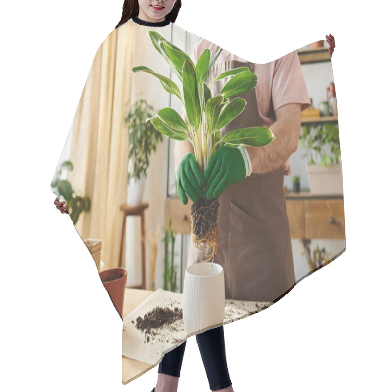 Personality  A Man Delicately Holds A Potted Plant On A Wooden Table At A Plant Shop, Showcasing His Green Thumb Skills And Love For Nature. Hair Cutting Cape