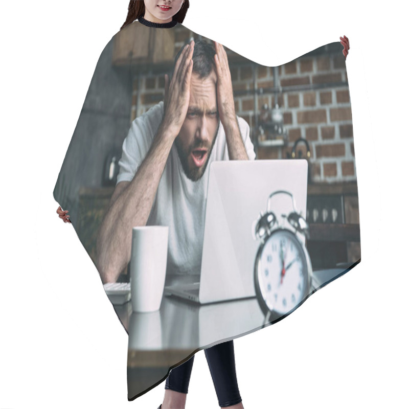 Personality  Portrait Of Overworked Freelancer Remote Working At Table With Laptop, Clock And Cup Of Coffee In Kitchen At Home Hair Cutting Cape