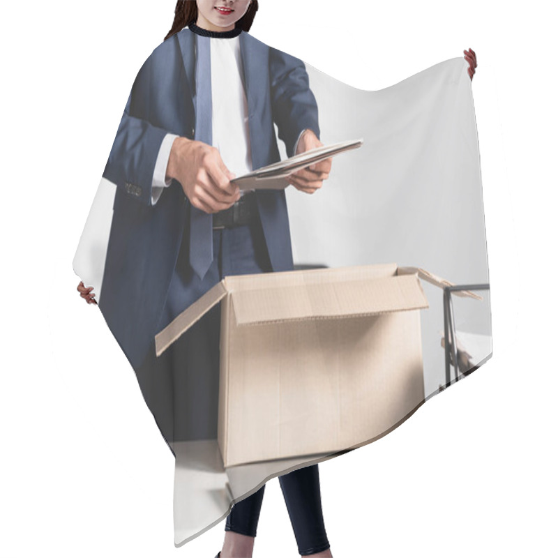 Personality  Cropped View Of Dismissed Businessman Holding Paper Folder Near Laptop And Cardboard Box On Blurred Foreground  Hair Cutting Cape