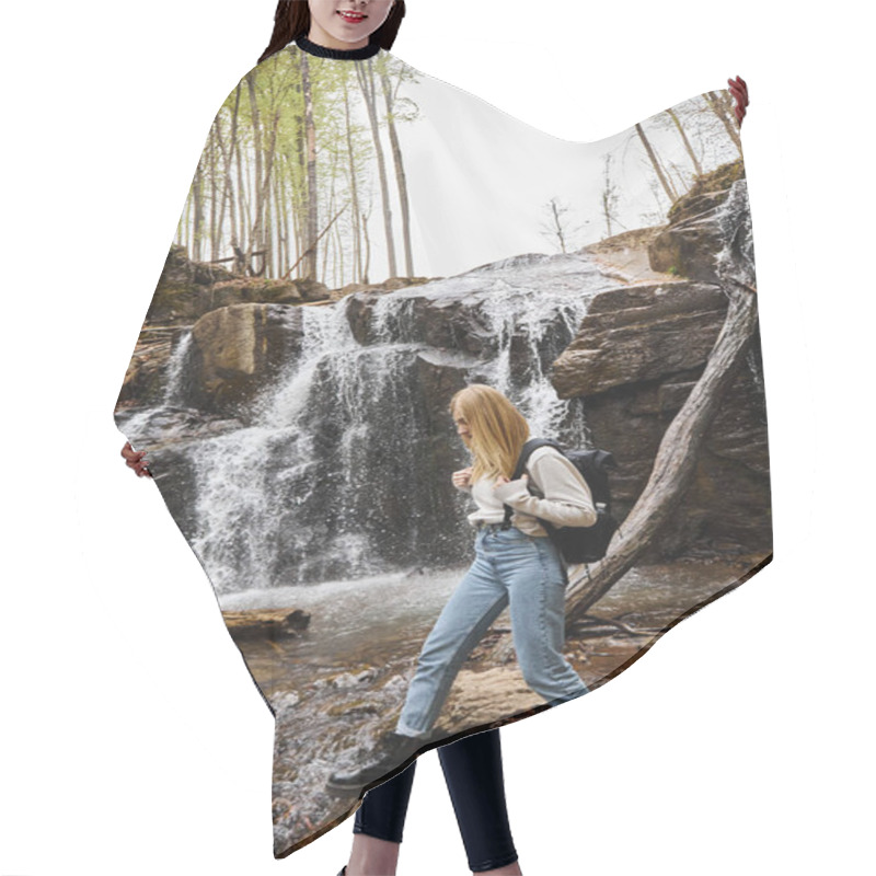 Personality  Active Blonde Female Hiker Crossing The Forest Creek Walking On Rocks Near Waterfall Hair Cutting Cape