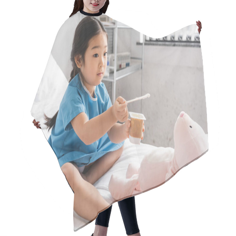 Personality  Barefoot Asian Girl Holding Delicious Yogurt Near Toy Bunny While Sitting On Hospital Bed Hair Cutting Cape