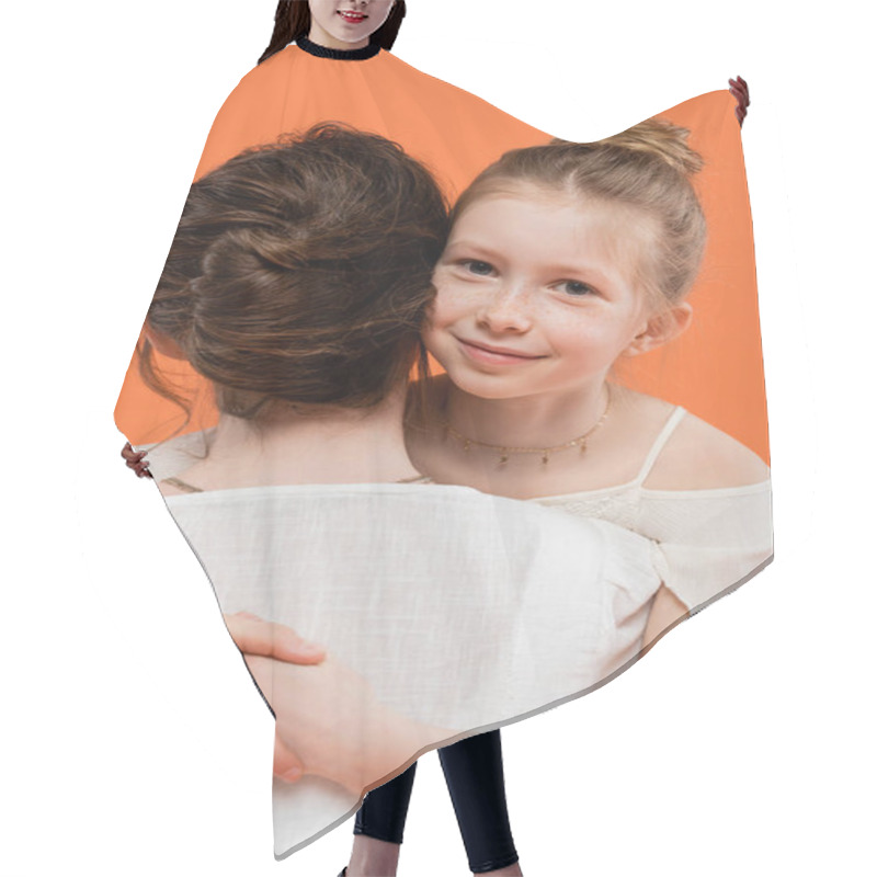 Personality  Family Moments, Happy Preteen Girl Hugging Brunette Mother On Orange Background, Looking At Camera, White Sun Dresses, Female Bonding, Love And Care, Togetherness, Joy Hair Cutting Cape