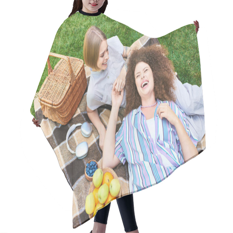 Personality  Two Cheerful Young Women Relax Together On A Blanket, Sharing Laughter And Delicious Fruits. Hair Cutting Cape