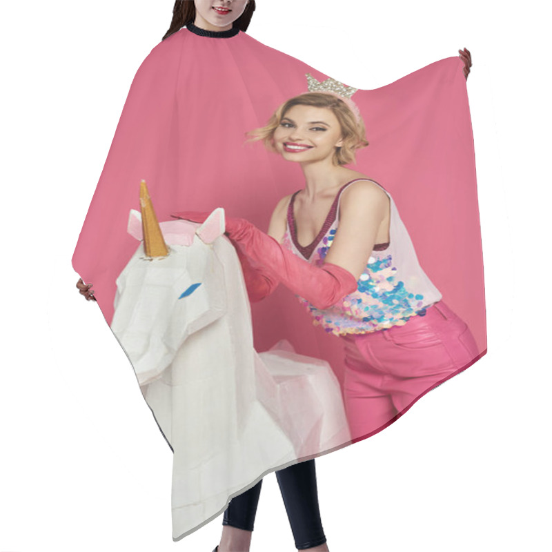 Personality  Woman In Pink Clothing And Crown Smiles By White Unicorn On Pink Background. Hair Cutting Cape