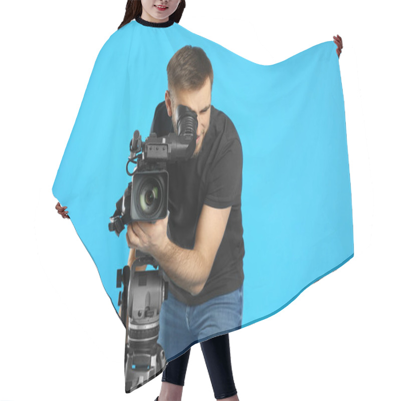 Personality  Operator With Professional Video Camera On Blue Background Hair Cutting Cape