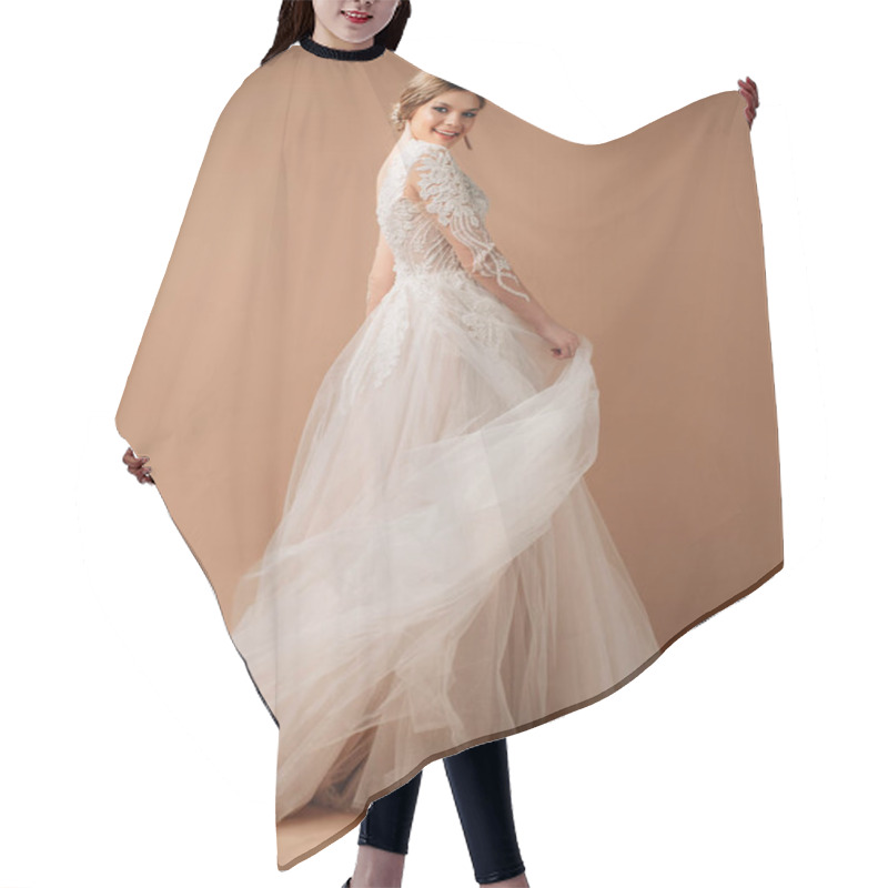 Personality  Posh Wedding Dress. Fashionable Bridal Gown With Tender French Lace And Beads, Long Sleeves, Weightless Tulle Skirt. Contemporary Design. Beautiful Happy Bride. Studio Shot On Beige Background. Hair Cutting Cape