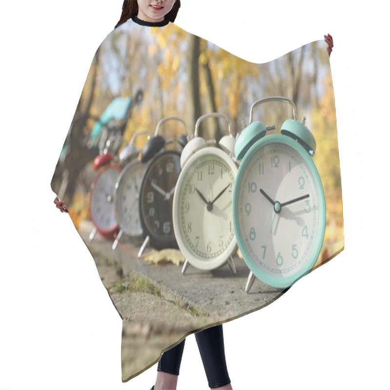 Personality  Alarm Clocks On Paved Pathway In Park At Autumn Hair Cutting Cape