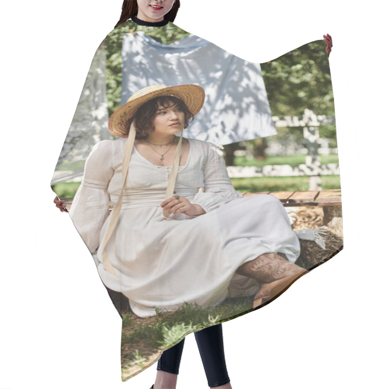 Personality  A Young Woman In A White Dress And Straw Hat Sits On A Bale Of Hay In A Summer Garden. Hair Cutting Cape