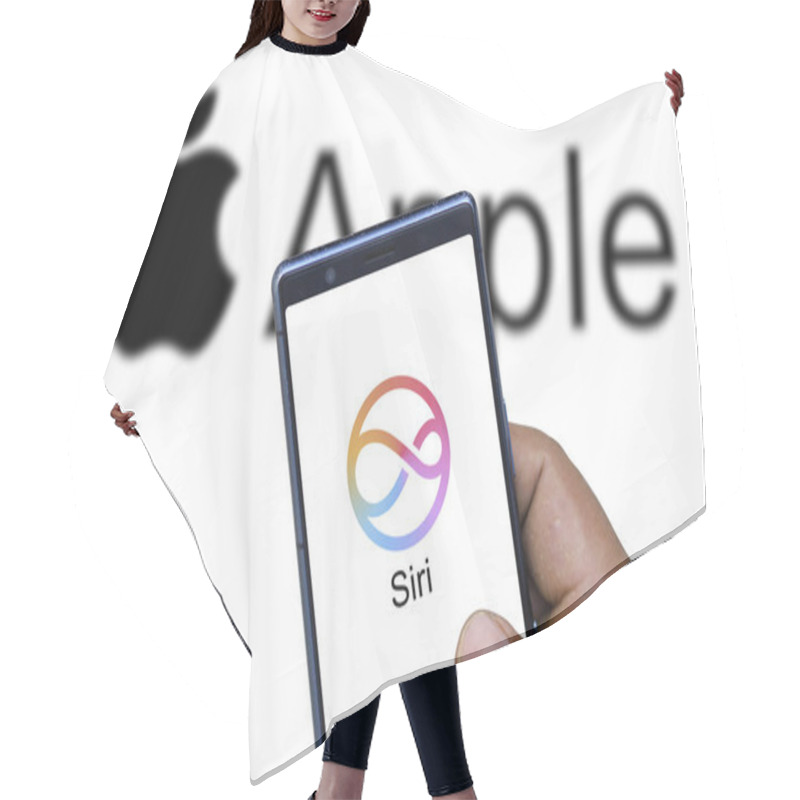 Personality  Dhaka,Bangladesh 04 Nov 2024:Apple Siri Logo Is Displayed On Smartphone. Hair Cutting Cape