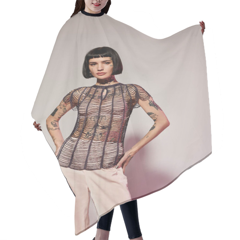 Personality  A Fashionable Woman Confidently Poses In An Artistic Studio Space. Hair Cutting Cape