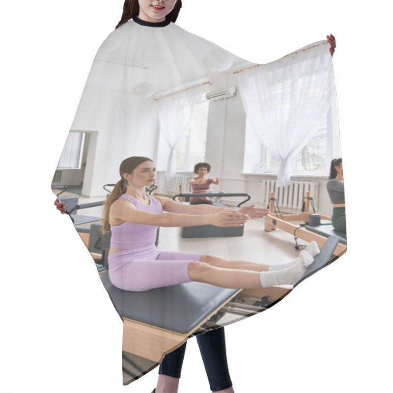 Personality  A Diverse Group Of Women In A Vibrant Gym Setting, Pilates. Hair Cutting Cape