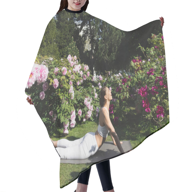 Personality  Side View Of Happy Woman Practicing Yoga In Cobra Pose On Lawn Near Laptop Hair Cutting Cape