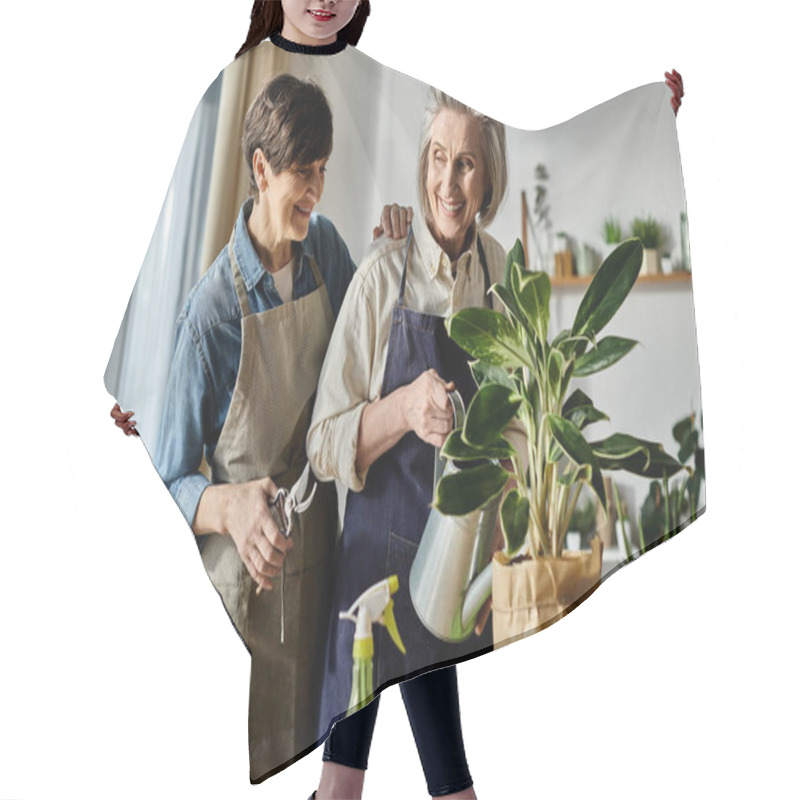 Personality  Mature Lesbian Couple In Aprons Nurturing A Plant Together. Hair Cutting Cape