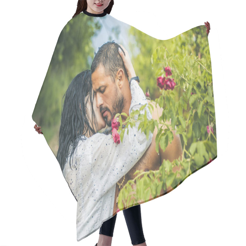 Personality  Love In The Garden. Passionate Couple In The Garden Hugging. Hair Cutting Cape