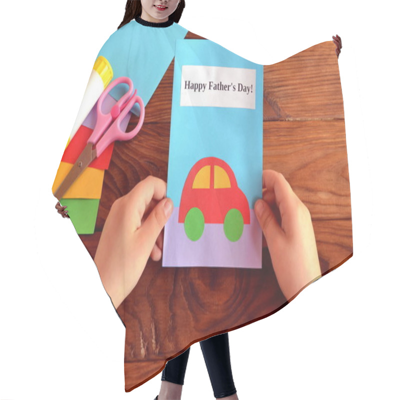 Personality  Child Holds A Card In His Hand. Greeting Card Happy Father's Day. Paper Sheets, Scissors, Glue. How To Make A Greeting Card Father's Day  Hair Cutting Cape