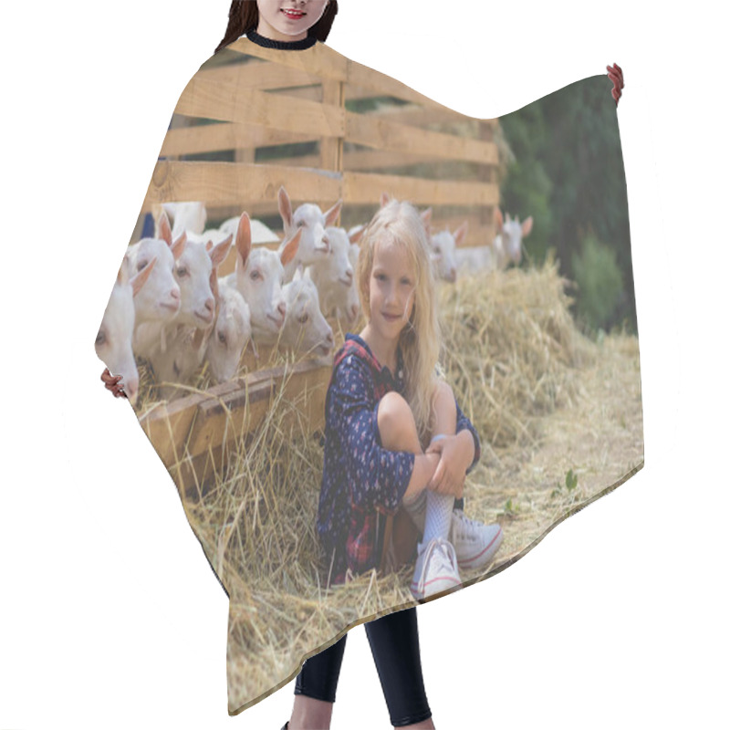 Personality  Kid Sitting On Hay Near Goats Behind Fences At Farm And Looking At Camera Hair Cutting Cape