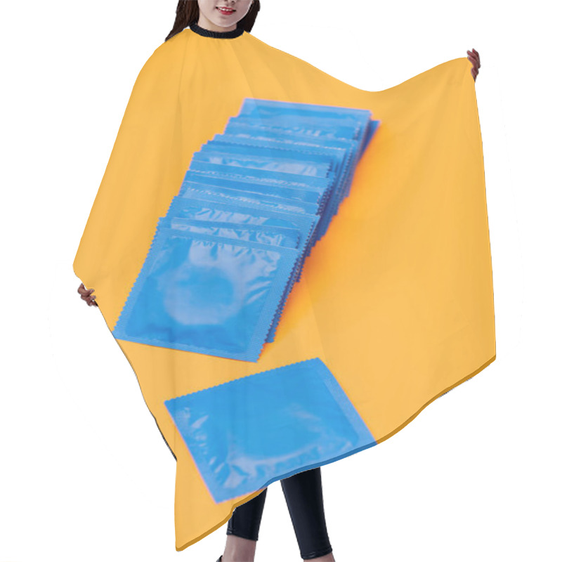 Personality  Condoms In Blue Packs Isolated On Orange  Hair Cutting Cape