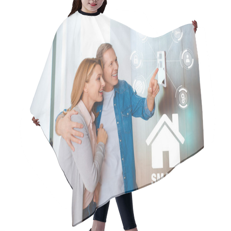 Personality  Happy Husband Hugging Wife While Pointing At Smart House System Control Panel Hair Cutting Cape