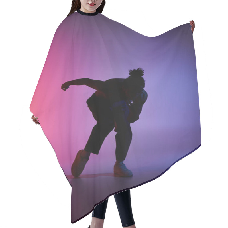 Personality  Silhouetted African American Man Dances Energetically Against Vibrant Background, Showcasing Contemporary Movement. Hair Cutting Cape