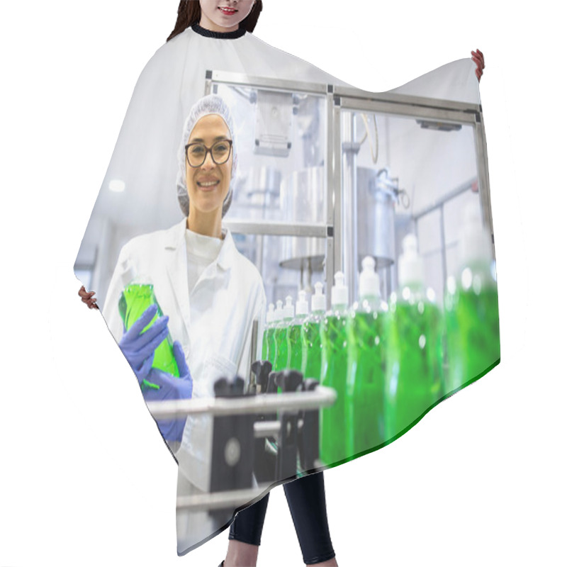 Personality  Portrait Of Female Technologist Inside Cleaning Chemicals Factory Holding Detergent Or Sanitation Supplies. Hair Cutting Cape