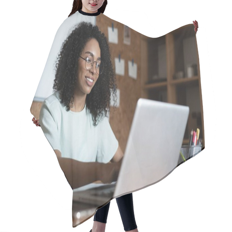 Personality  Young Beautiful African American Woman Using Her Laptop While Sitting In Chair At Her Working Place Hair Cutting Cape