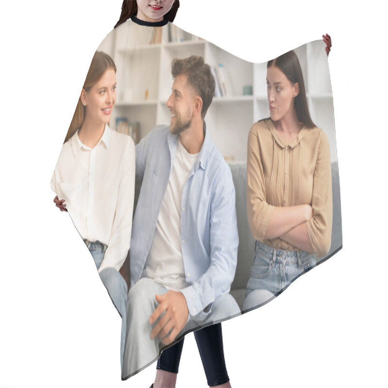 Personality  Young Man Hugs His Girlfriend On Couch While Another Woman Looks With Jealousy Crossing Hands, Sitting Together On Sofa In Modern Living Room. Infidelity, Complicated Romantic Triangle Hair Cutting Cape