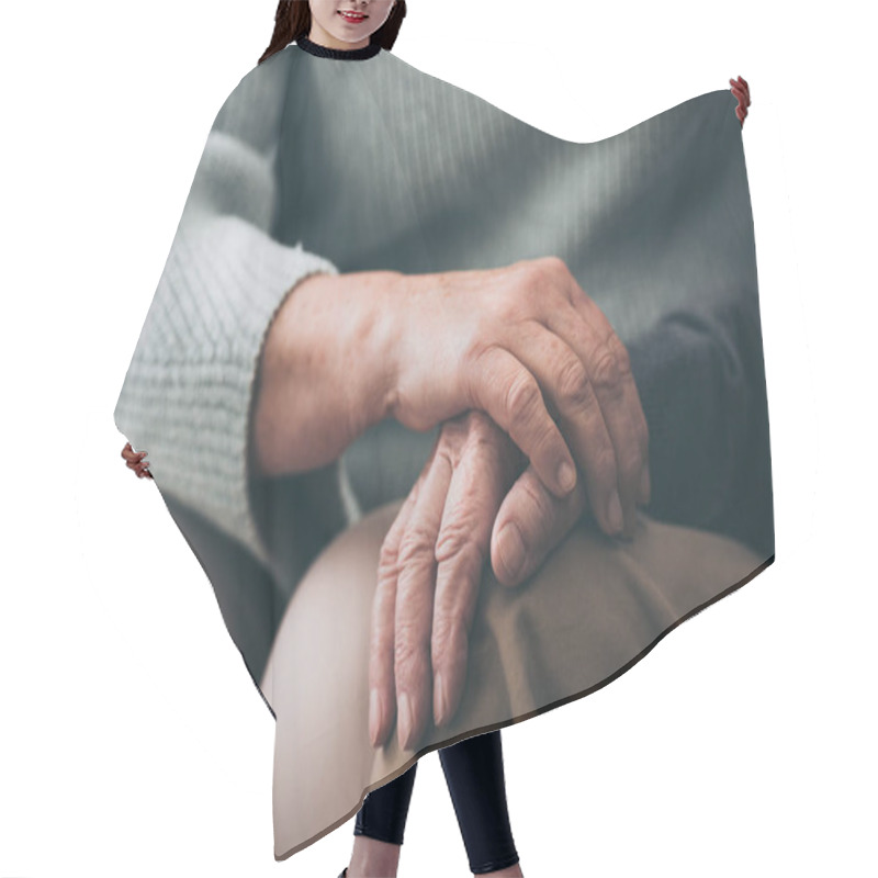 Personality  Cropped View Of Senior Woman Holding Hands With Retired Husband  Hair Cutting Cape