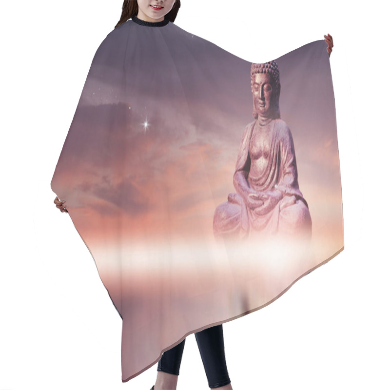 Personality  Buddha Statue Sitting In Meditation Pose Against Sunset Sky With Golden Tones Clouds. Hair Cutting Cape