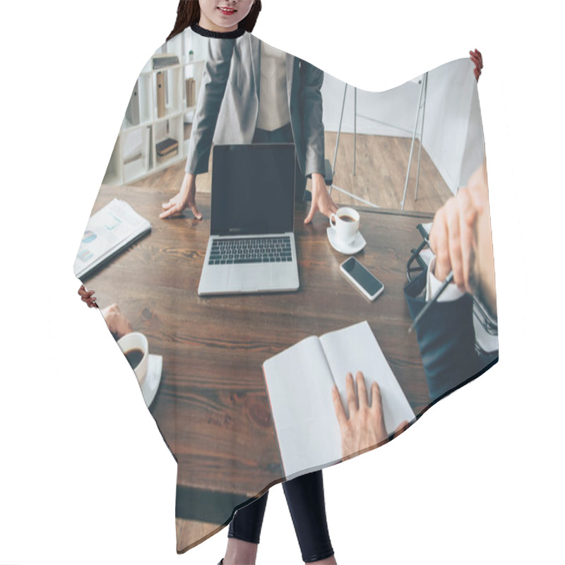 Personality  Businesswoman Standing Near Laptop With Blank Screen And Colleagues With Coffee And Notebook On Blurred Foreground  Hair Cutting Cape