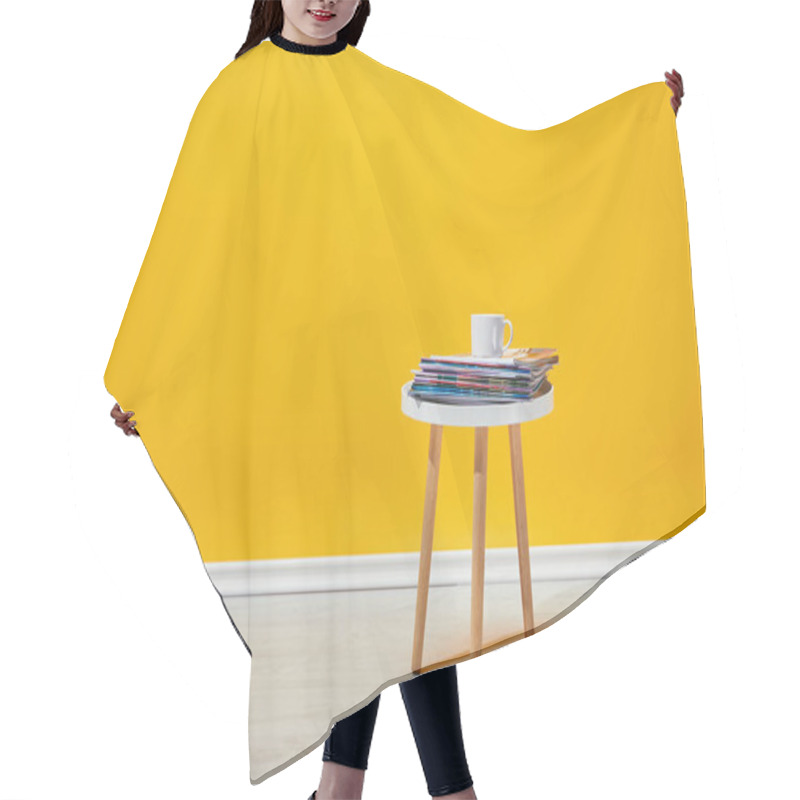 Personality  Little Wooden Table With Pile Of Magazines And White Cup Of Coffee Near Yellow Wall Hair Cutting Cape