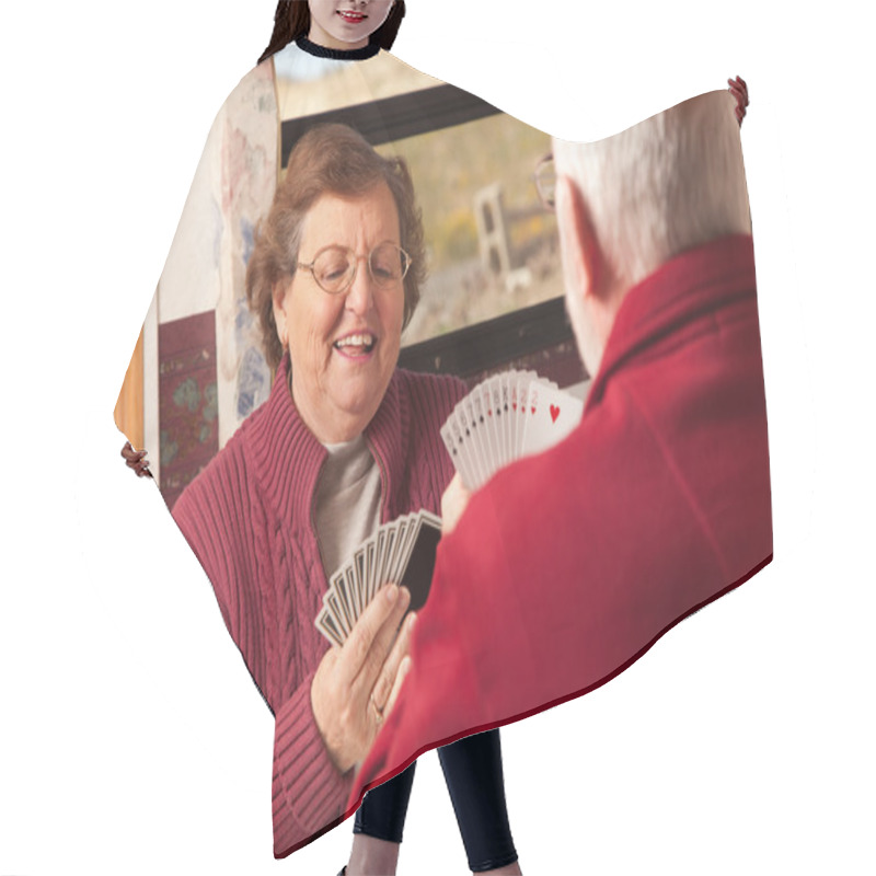 Personality  Happy Senior Adult Couple Playing Cards In Their Trailer RV Hair Cutting Cape