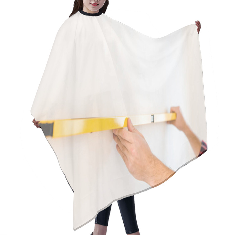 Personality  Cropped View Of Man Measuring Wall At Home Hair Cutting Cape