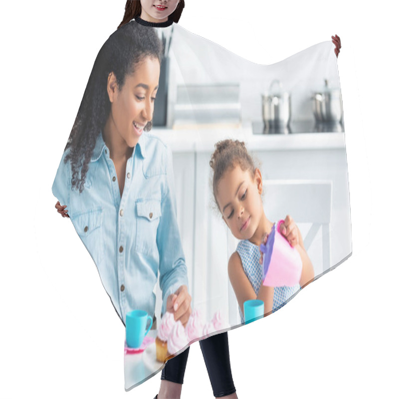 Personality  African American Daughter And Mother Playing With Plastic Dishes In Kitchen Hair Cutting Cape