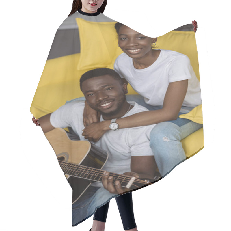 Personality  Happy Young African American Couple With Acoustic Guitar Smiling At Camera Hair Cutting Cape