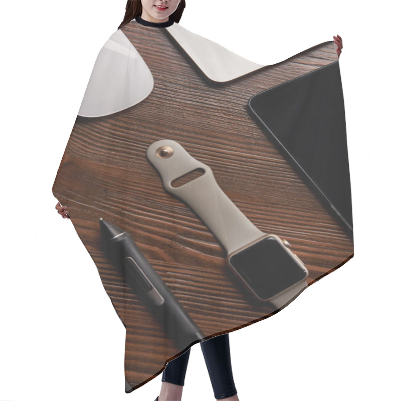 Personality  Top View Of Smart Watch With Various Gadgets On Wooden Table Hair Cutting Cape