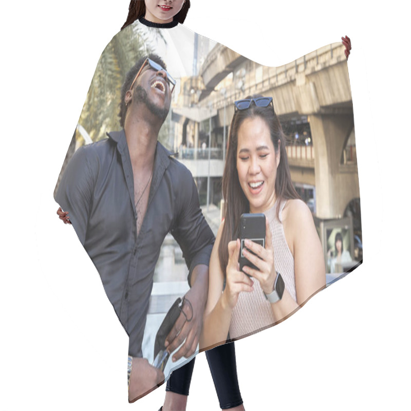 Personality  Multiracial Friends Laughing And Using The Mobile Next To A Mall Hair Cutting Cape