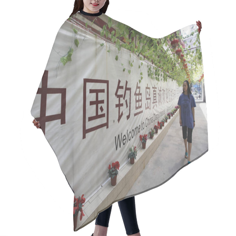 Personality  A Staff Member Walks Past A Banner With Signs Saying, Welcome To China Diaoyu Islands, At Diaoyu Islands Hotel In XiAn City, Northwest Chinas Shaanxi Province, 14 September 2012 Hair Cutting Cape