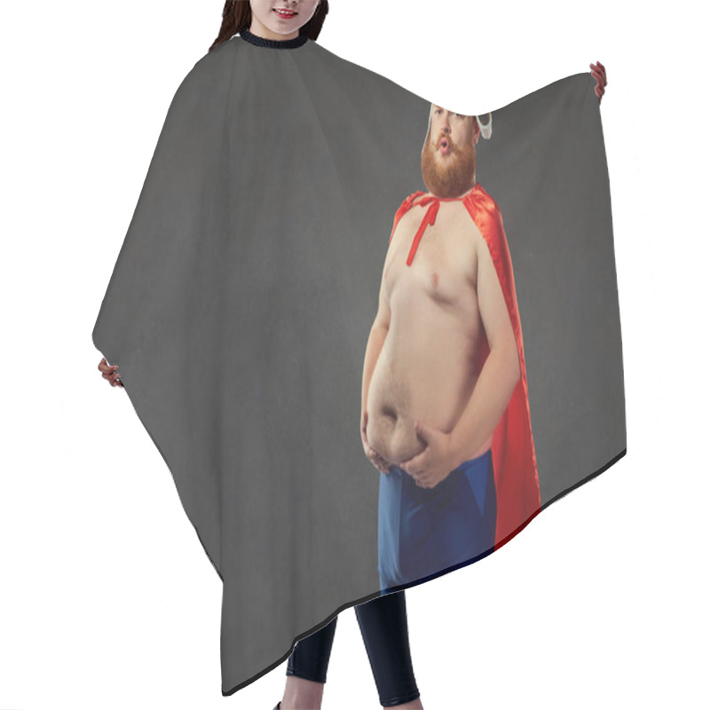 Personality  Fat Funny Man In Swimming Trunks In A Superhero Costume Holds On Hair Cutting Cape