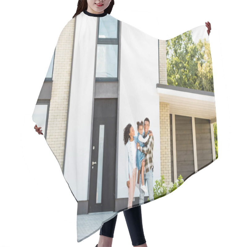 Personality  Full Length View Of African American Family Standing Near New House While Father Holding Kid  Hair Cutting Cape